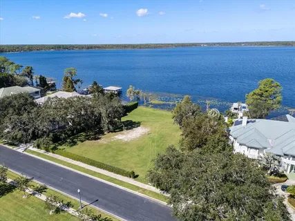 a view of a lake with a table and chairs