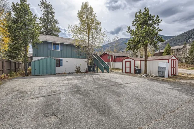 a view of a house with a yard and garage