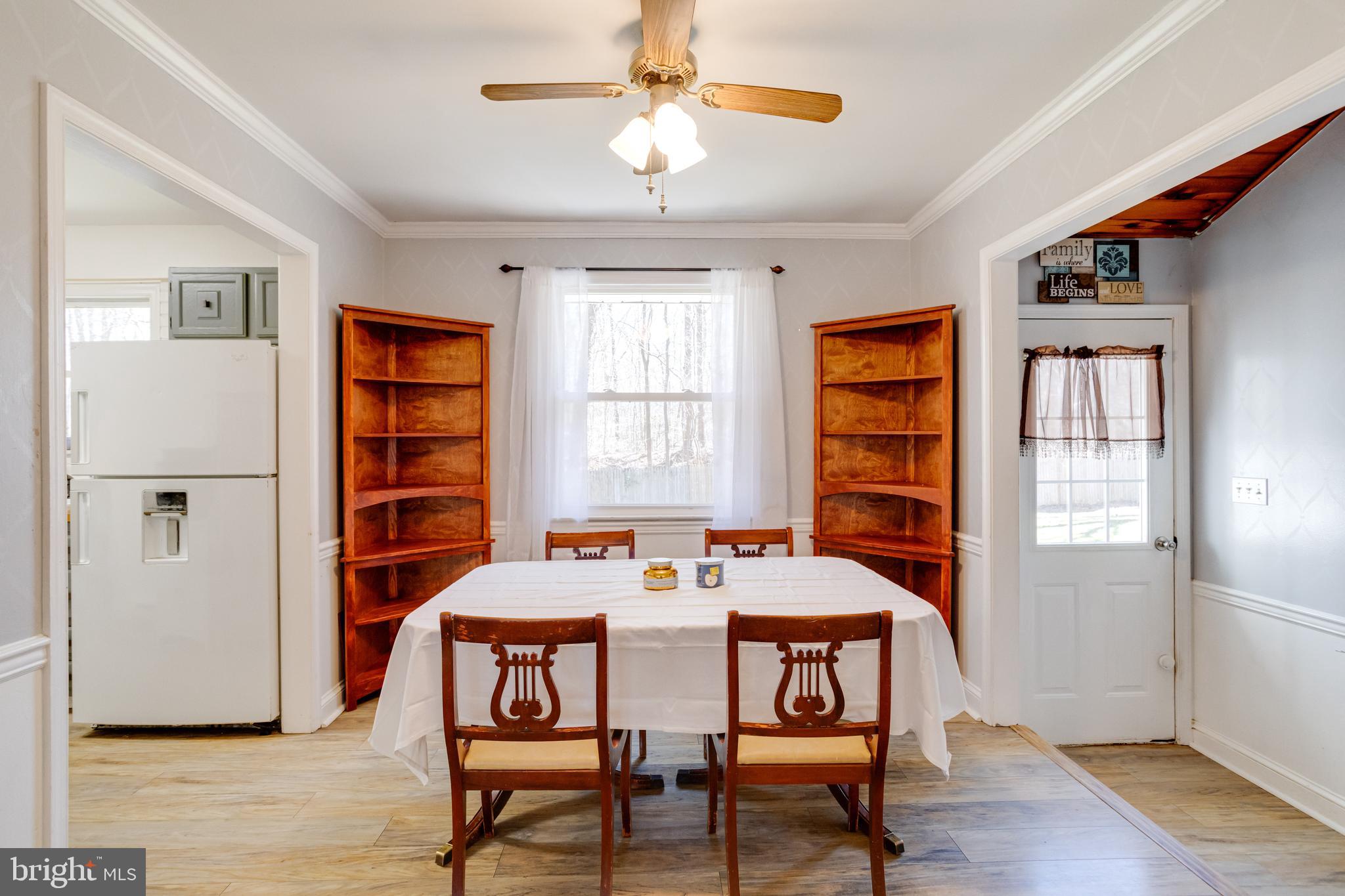 3220 Old Elk Neck Road Elkton, MD 21921 - Photo 8 of 44 Separate DR with crown molding and ceiling fan