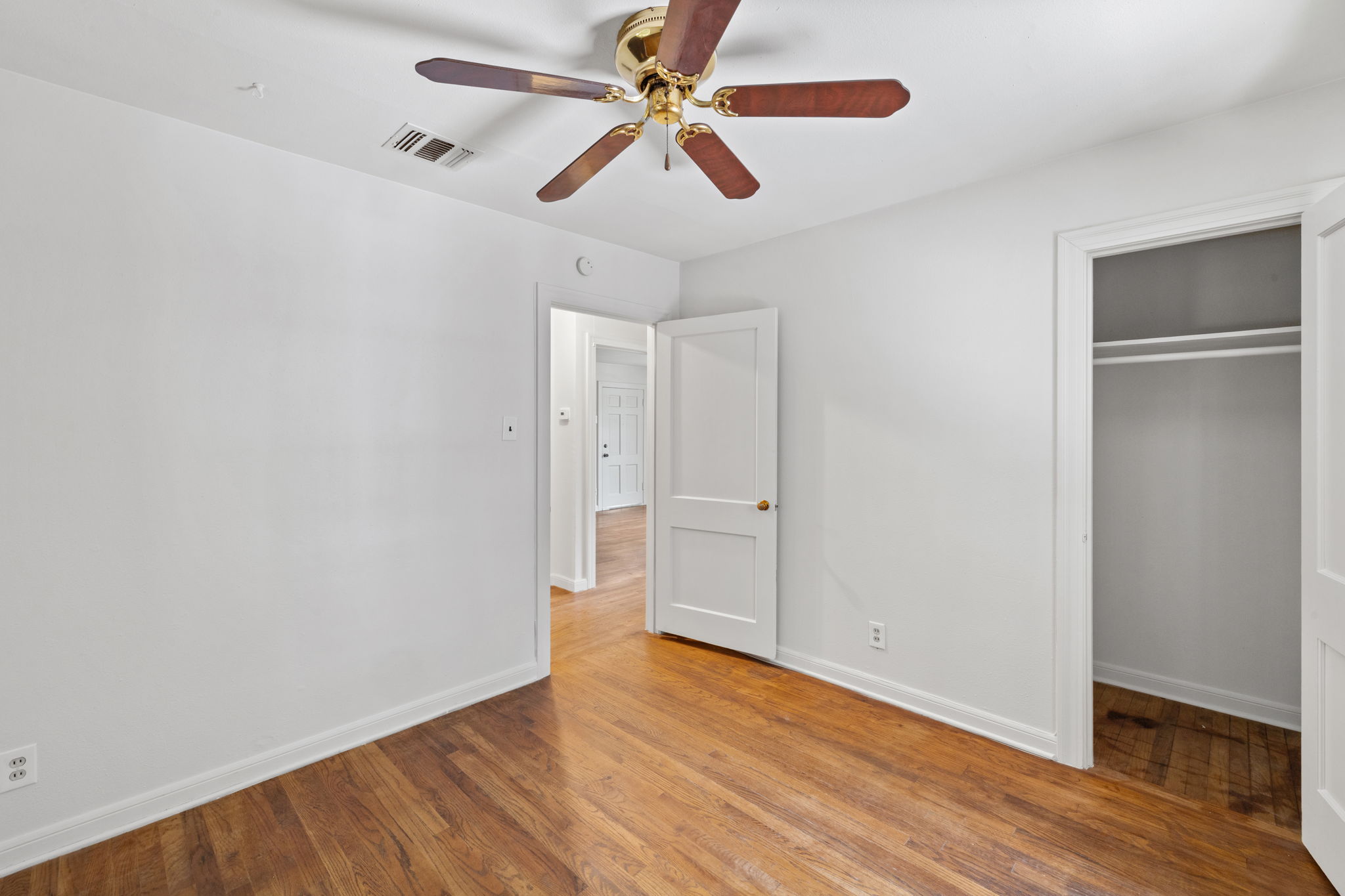 3704 Cherrywood Road Austin, TX 78722 - Photo 20 of 40 Original
wood flooring compliments this inviting bedroom. Nice sized closet with top shelf.