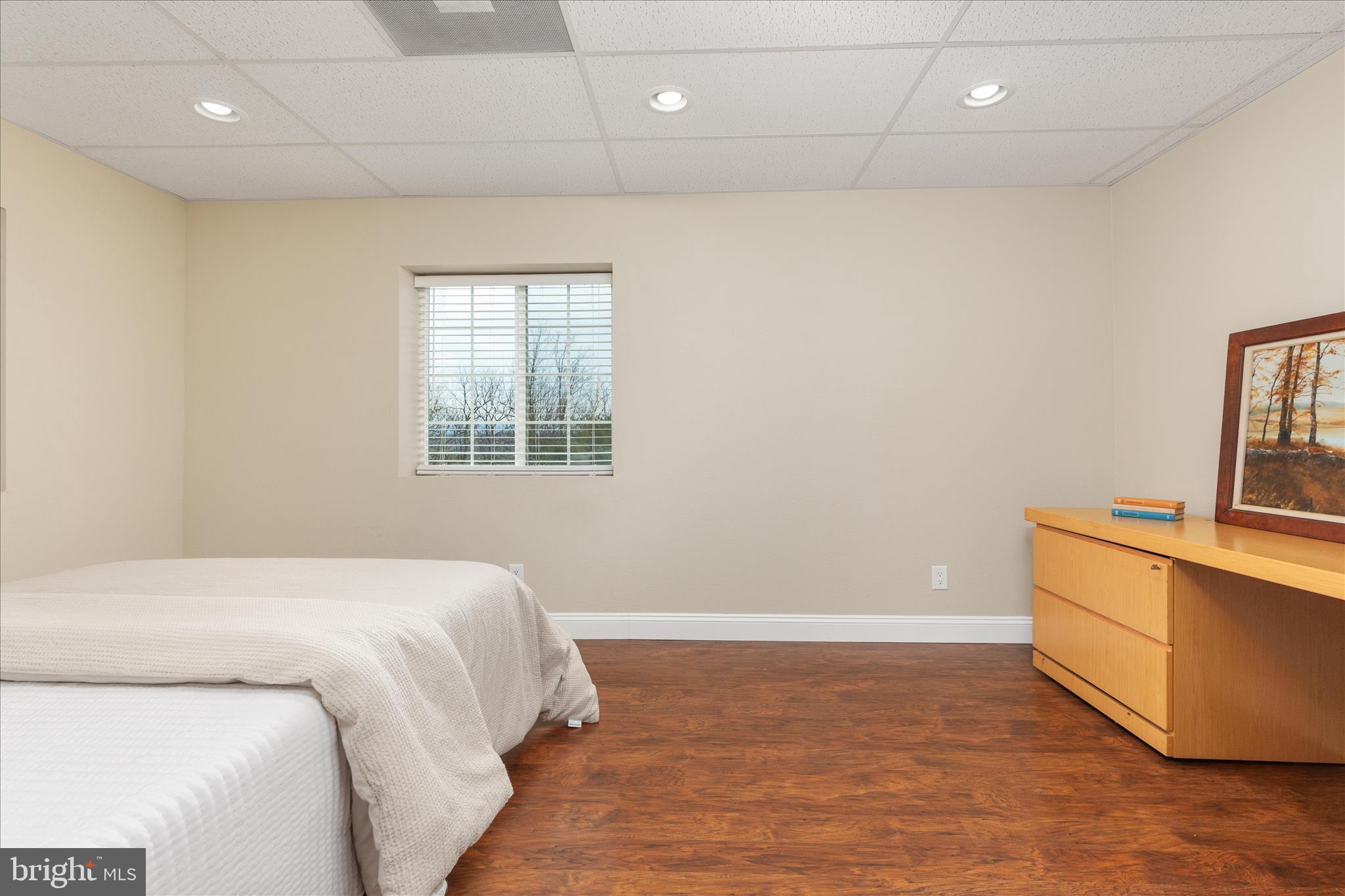 283 Rock Ridge Road Front Royal, VA 22630 - Photo 35 of 64 a bedroom with a bed and a flat screen tv