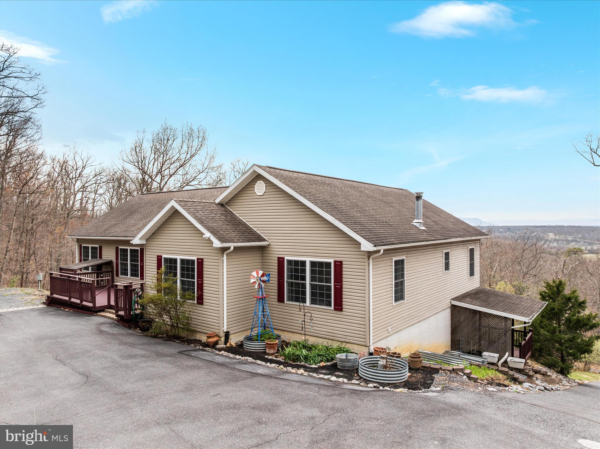 283 Rock Ridge Road Front Royal, VA 22630 - Photo 60 of 64 a front view of a house with a yard and garage