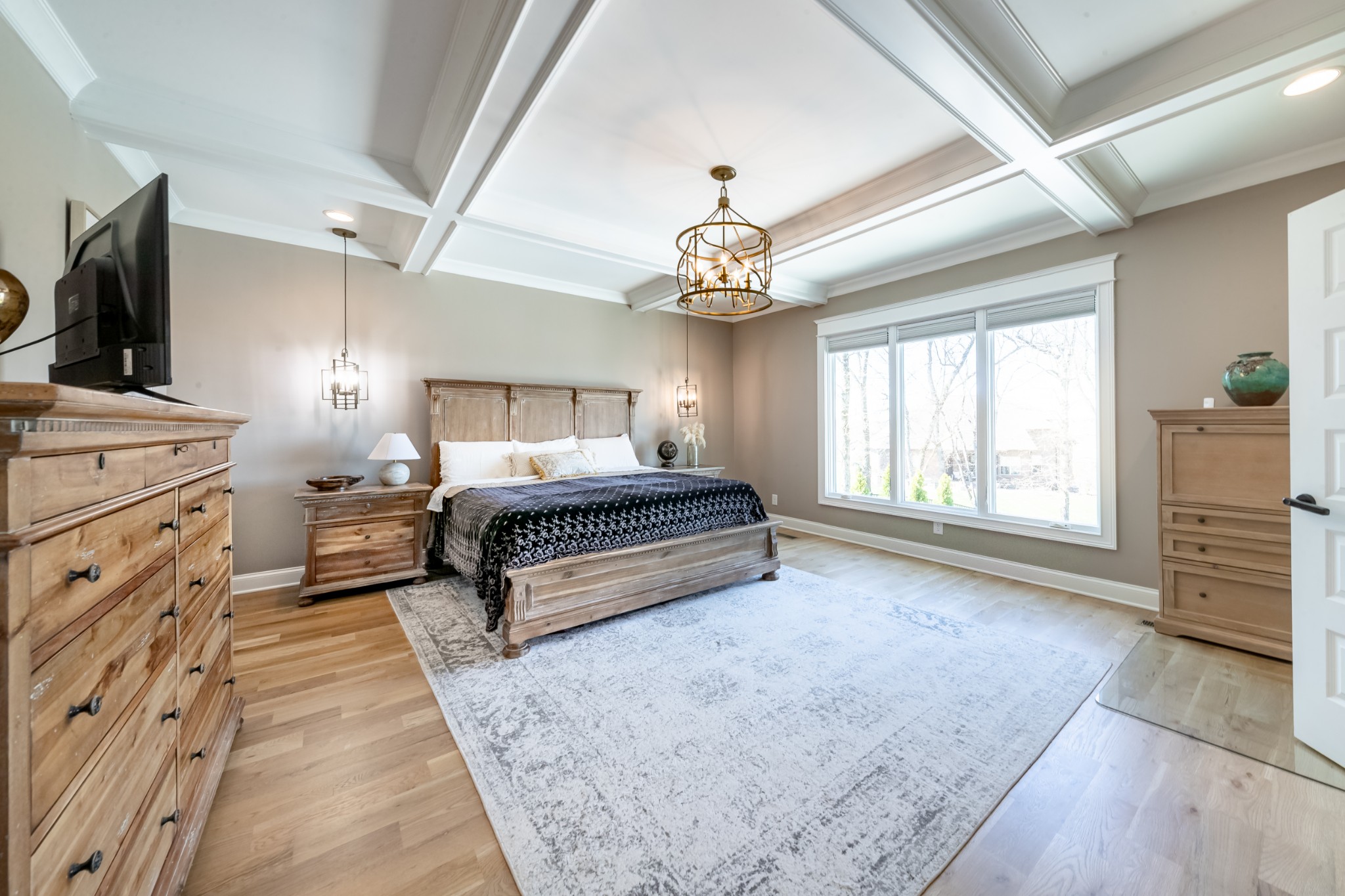 304 Charleston Street Lebanon, TN 37087 - Photo 16 of 51 a spacious bedroom with a bed and a chandelier