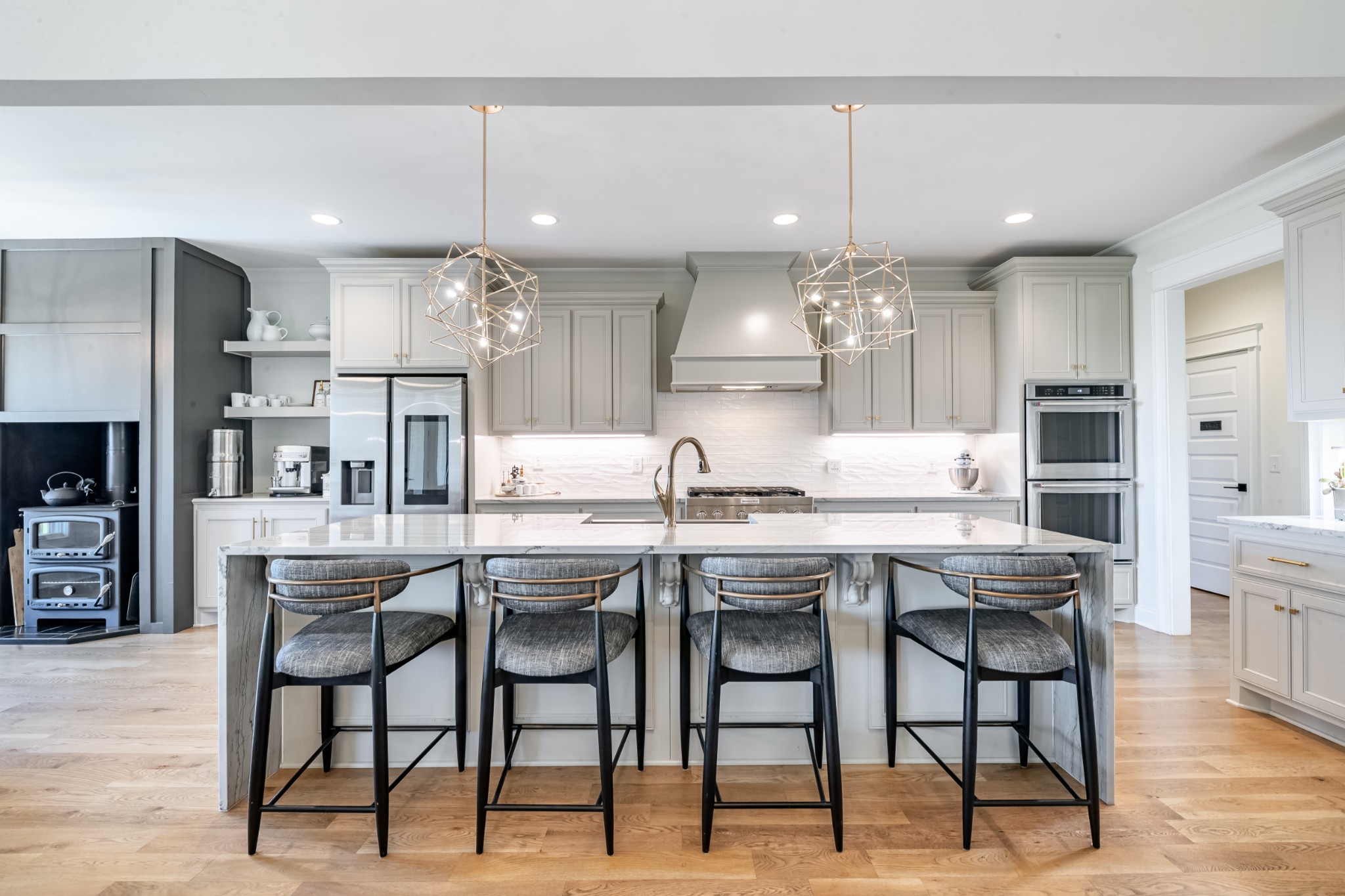 304 Charleston Street Lebanon, TN 37087 - Photo 2 of 51 a kitchen with kitchen island granite countertop a dining table chairs sink and cabinets
