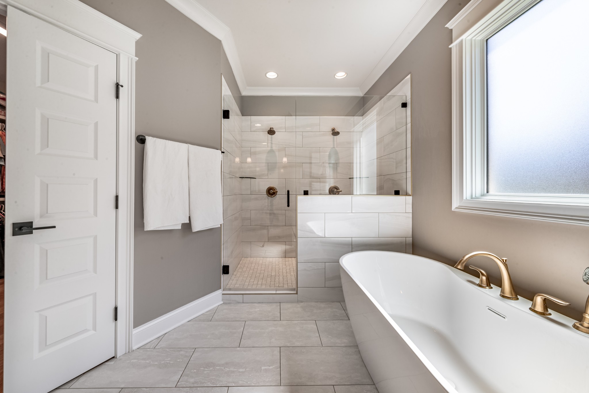 304 Charleston Street Lebanon, TN 37087 - Photo 21 of 51 a bathroom with a granite countertop sink a mirror and a bathtub
