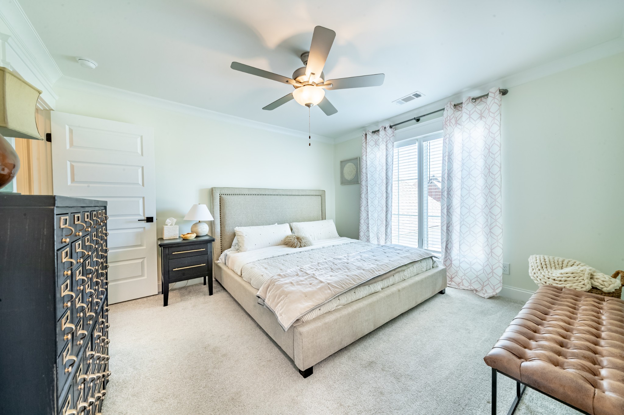 304 Charleston Street Lebanon, TN 37087 - Photo 30 of 51 a bedroom with a bed and a chandelier