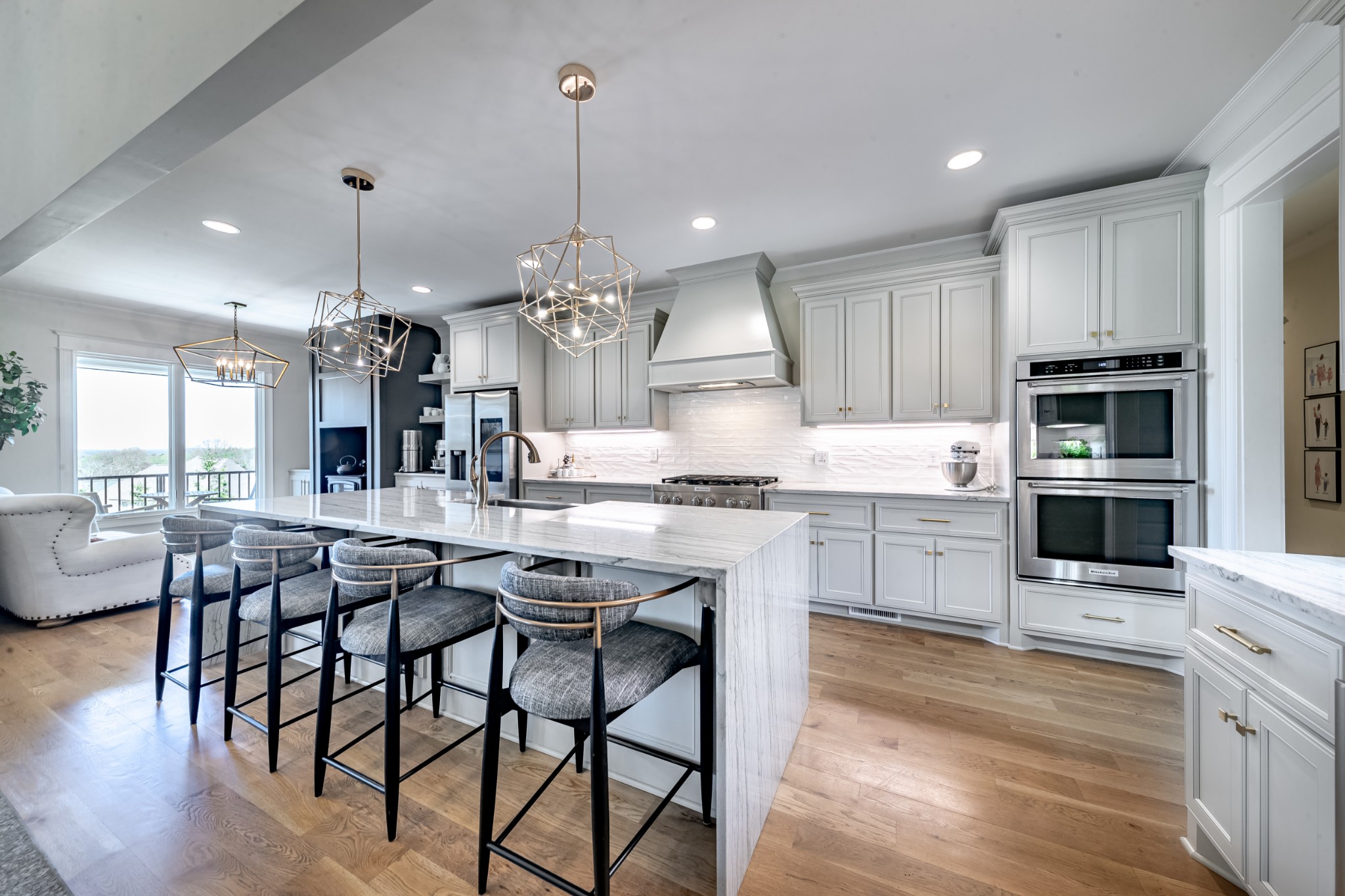 304 Charleston Street Lebanon, TN 37087 - Photo 3 of 51 a kitchen with stainless steel appliances kitchen island granite countertop a table chairs and a stove