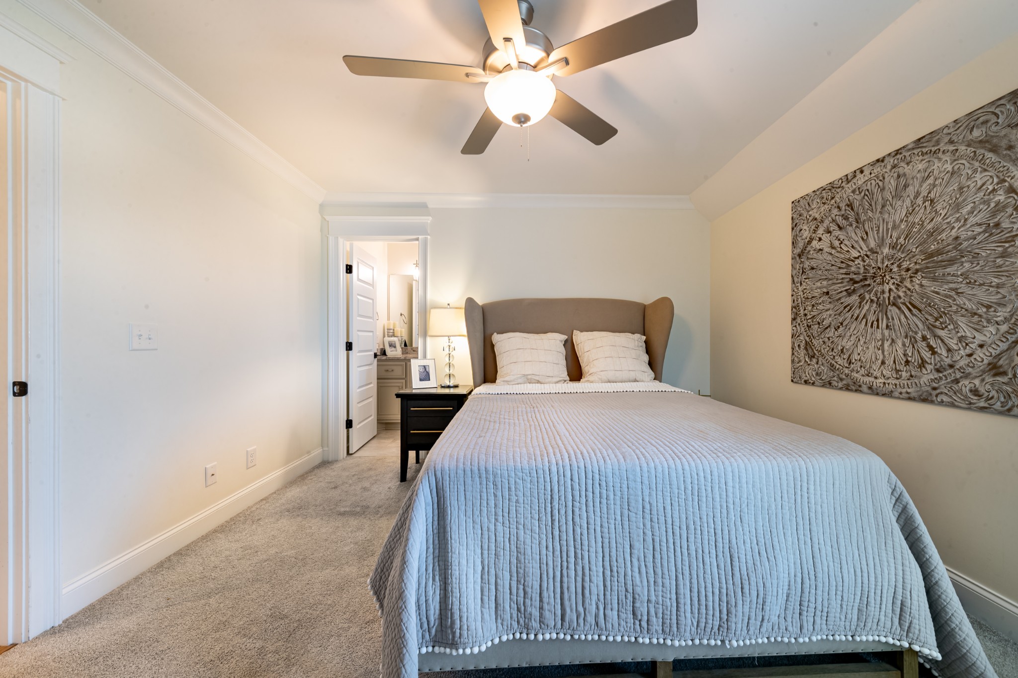 304 Charleston Street Lebanon, TN 37087 - Photo 34 of 51 a bedroom with a bed and a chandelier