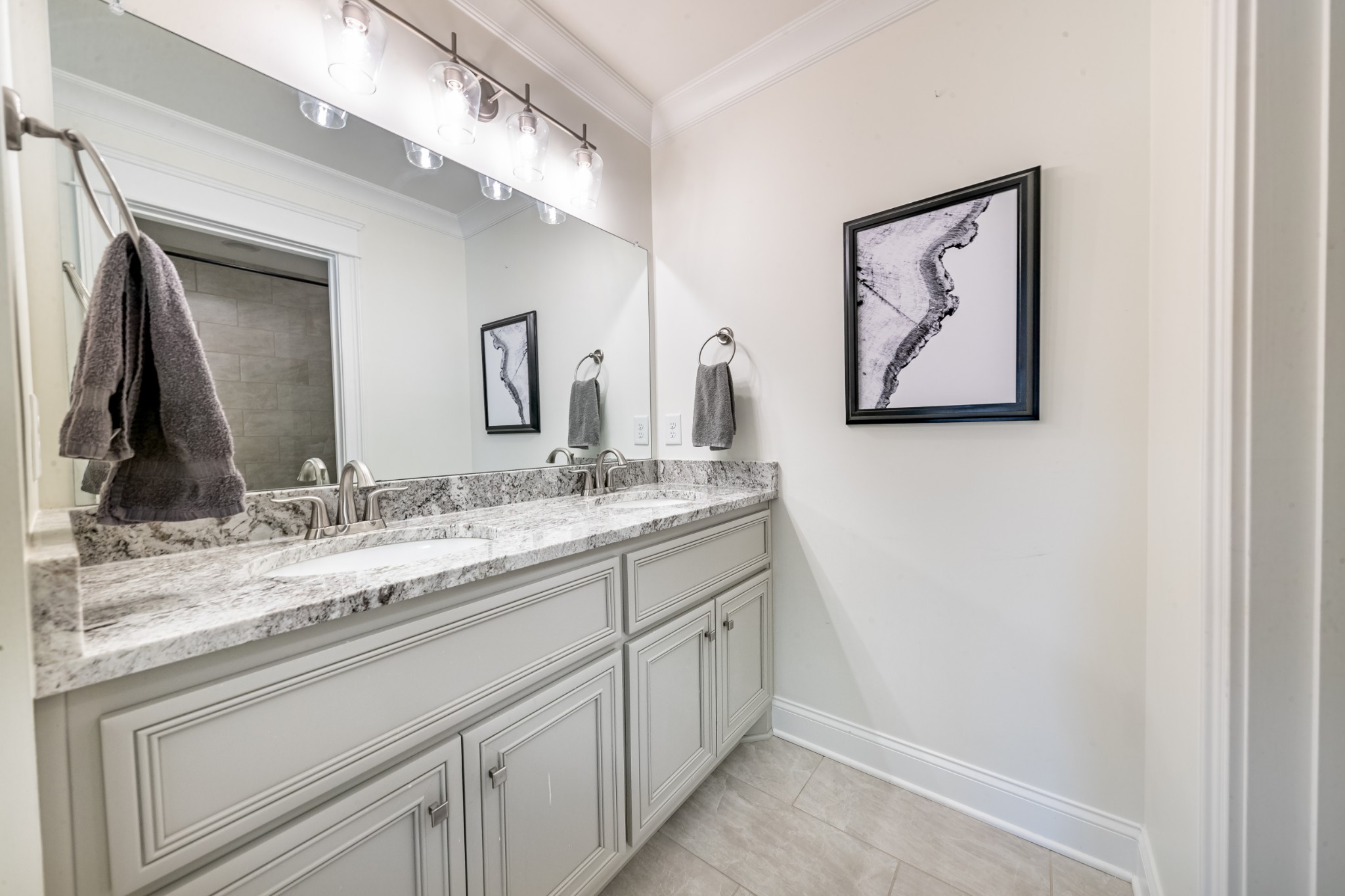 304 Charleston Street Lebanon, TN 37087 - Photo 35 of 51 a bathroom with a double vanity sink and a mirror