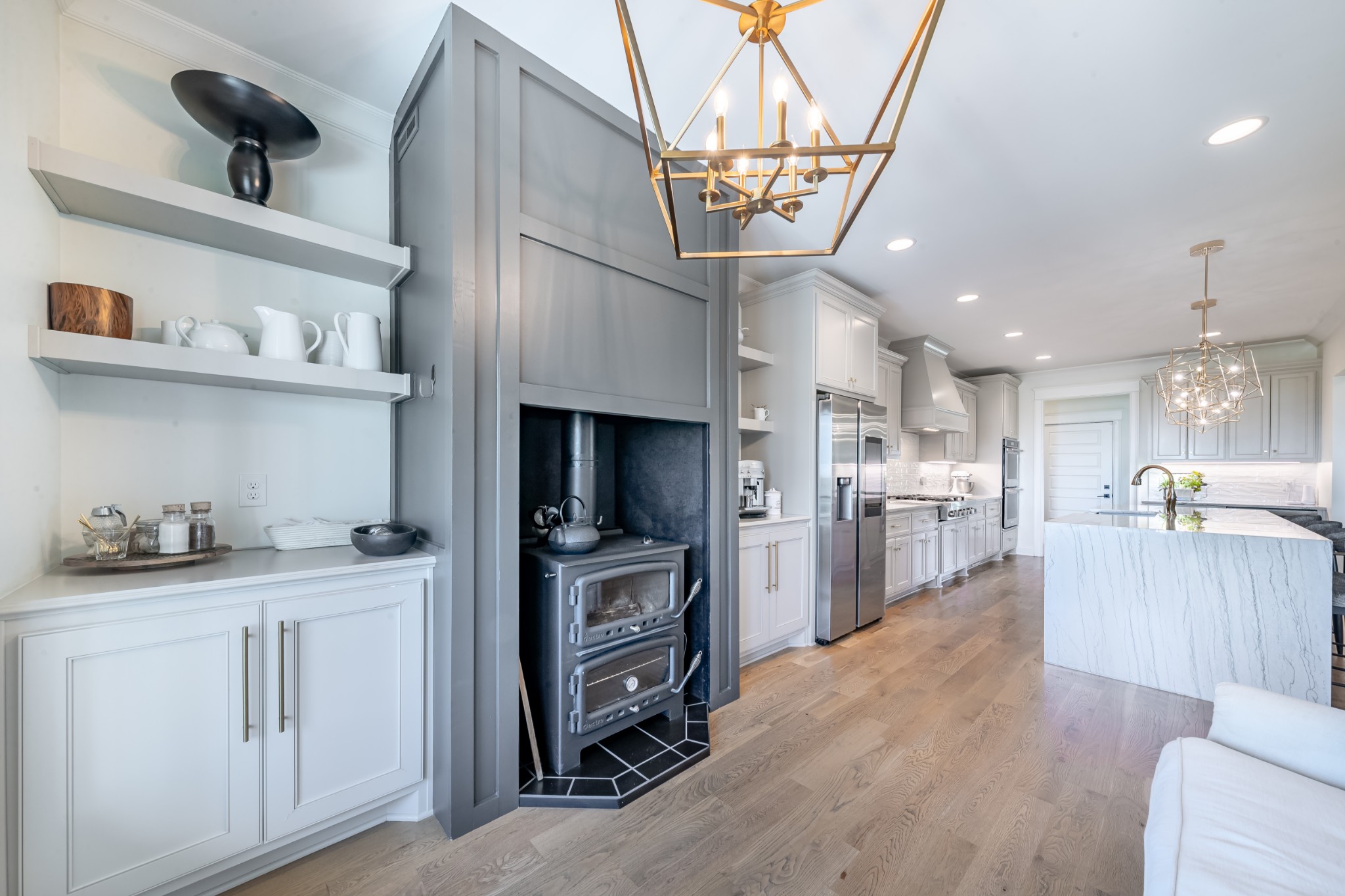 304 Charleston Street Lebanon, TN 37087 - Photo 8 of 51 a kitchen with stainless steel appliances kitchen island granite countertop a refrigerator a stove a sink and a dining table with wooden floor