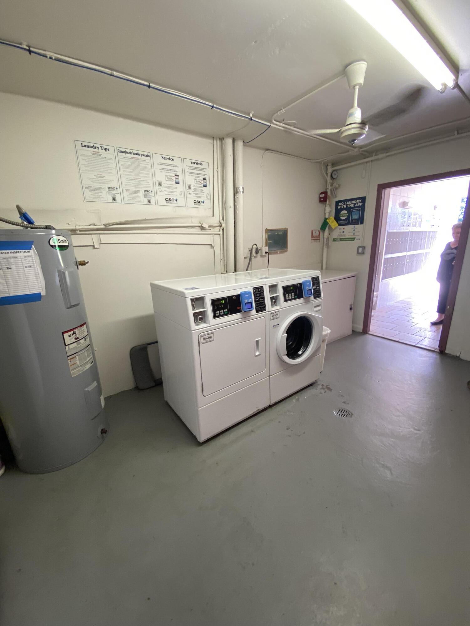 429 Fanshaw North, Unit K Boca Raton, FL 33434 - Photo 14 of 16 a utility room with dryer and washer