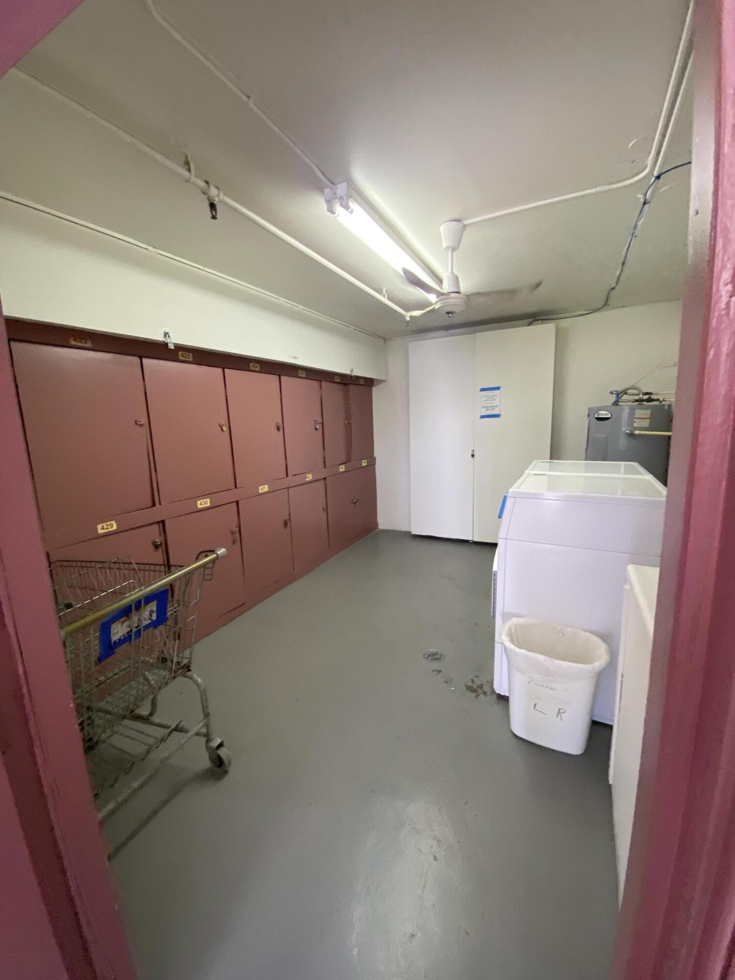 429 Fanshaw North, Unit K Boca Raton, FL 33434 - Photo 15 of 16 a room with a chair and white walls