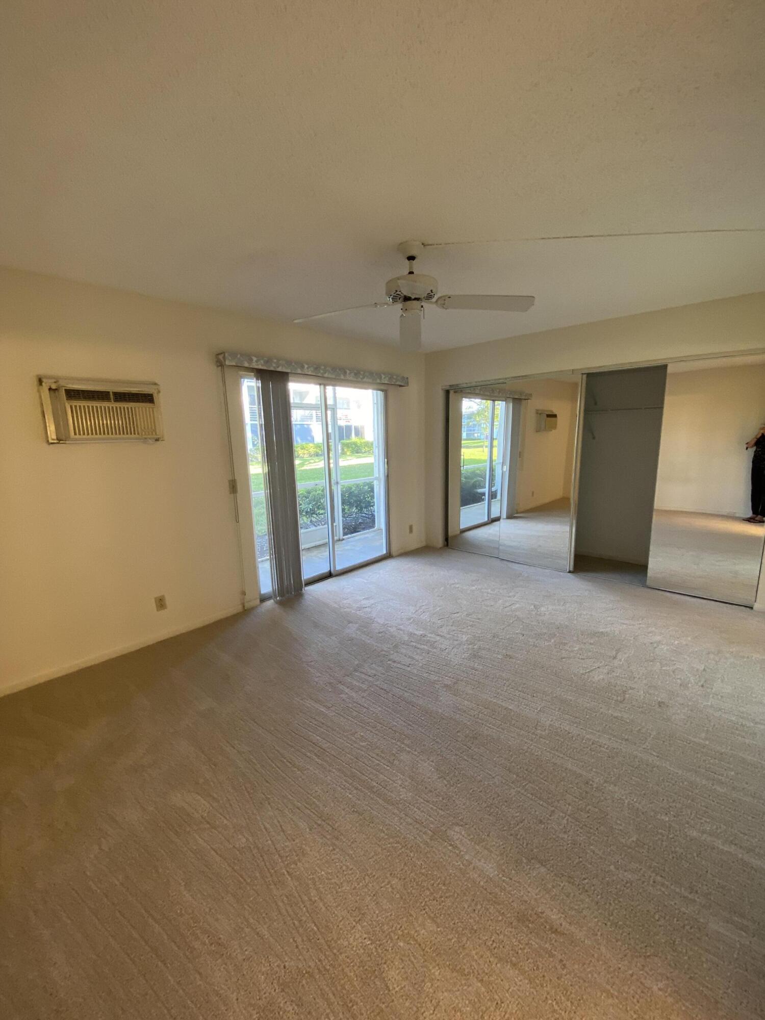 429 Fanshaw North, Unit K Boca Raton, FL 33434 - Photo 10 of 16 a view of an empty room with a window