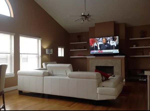 a living room with furniture and a large window