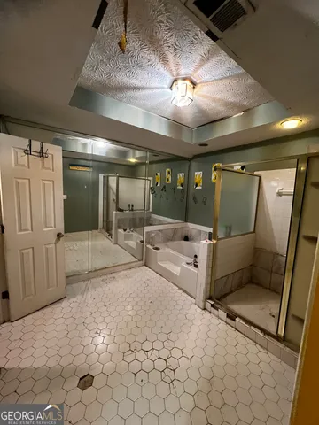 a bathroom with a sink toilet and mirror