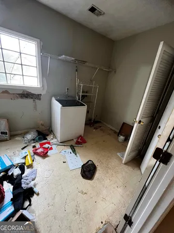 a view of an empty room with a window