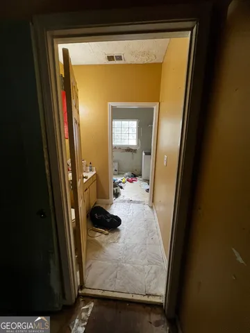 a view of a kitchen with furniture and a kitchen
