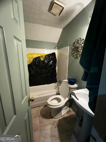 a living room with furniture a air conditioner vent and a window