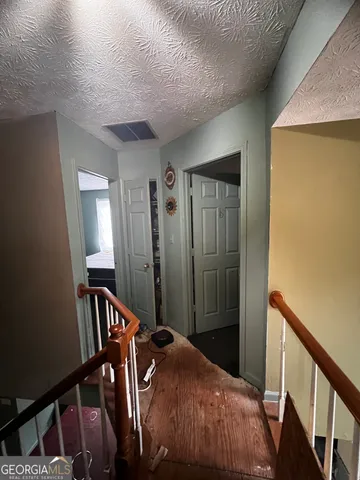 a view of a room with a staircase