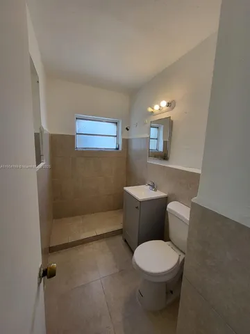 a kitchen that has a sink and a stove