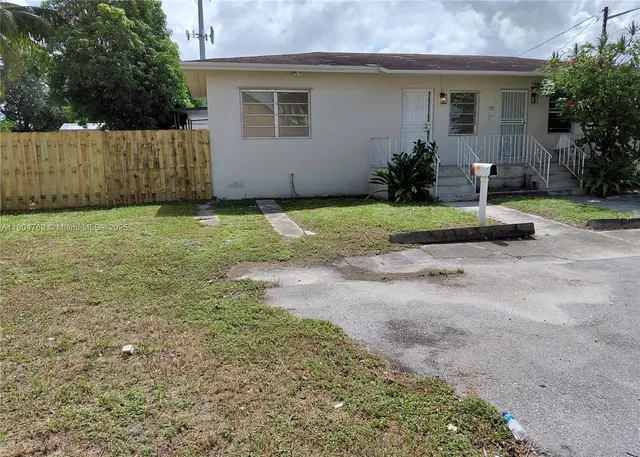 a house with trees in the background