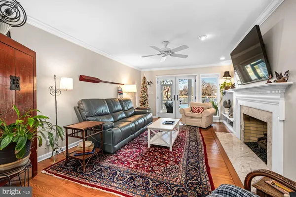 a bedroom with a bed couch and a window