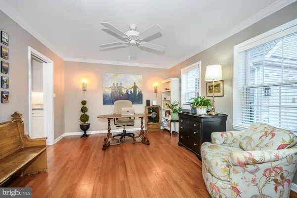 a spacious bedroom with a bed couches and a couch