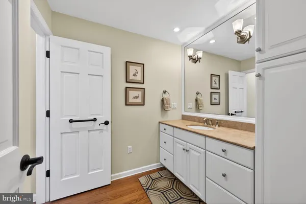 a kitchen with stainless steel appliances a refrigerator and cabinets