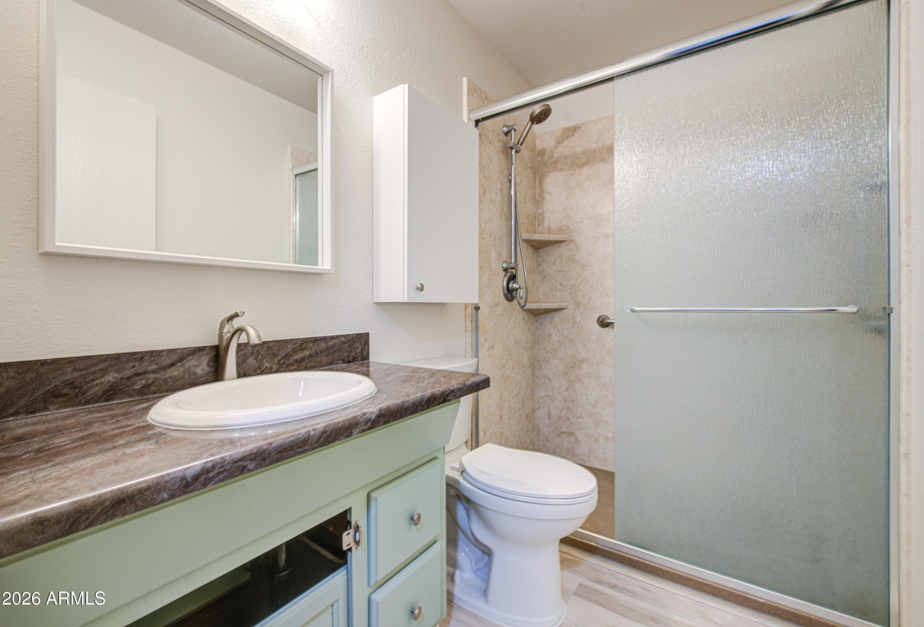 1350 North Boyd Road Apache Junction, AZ 85119 - Photo 23 of 31 a bathroom with a granite countertop sink toilet and shower