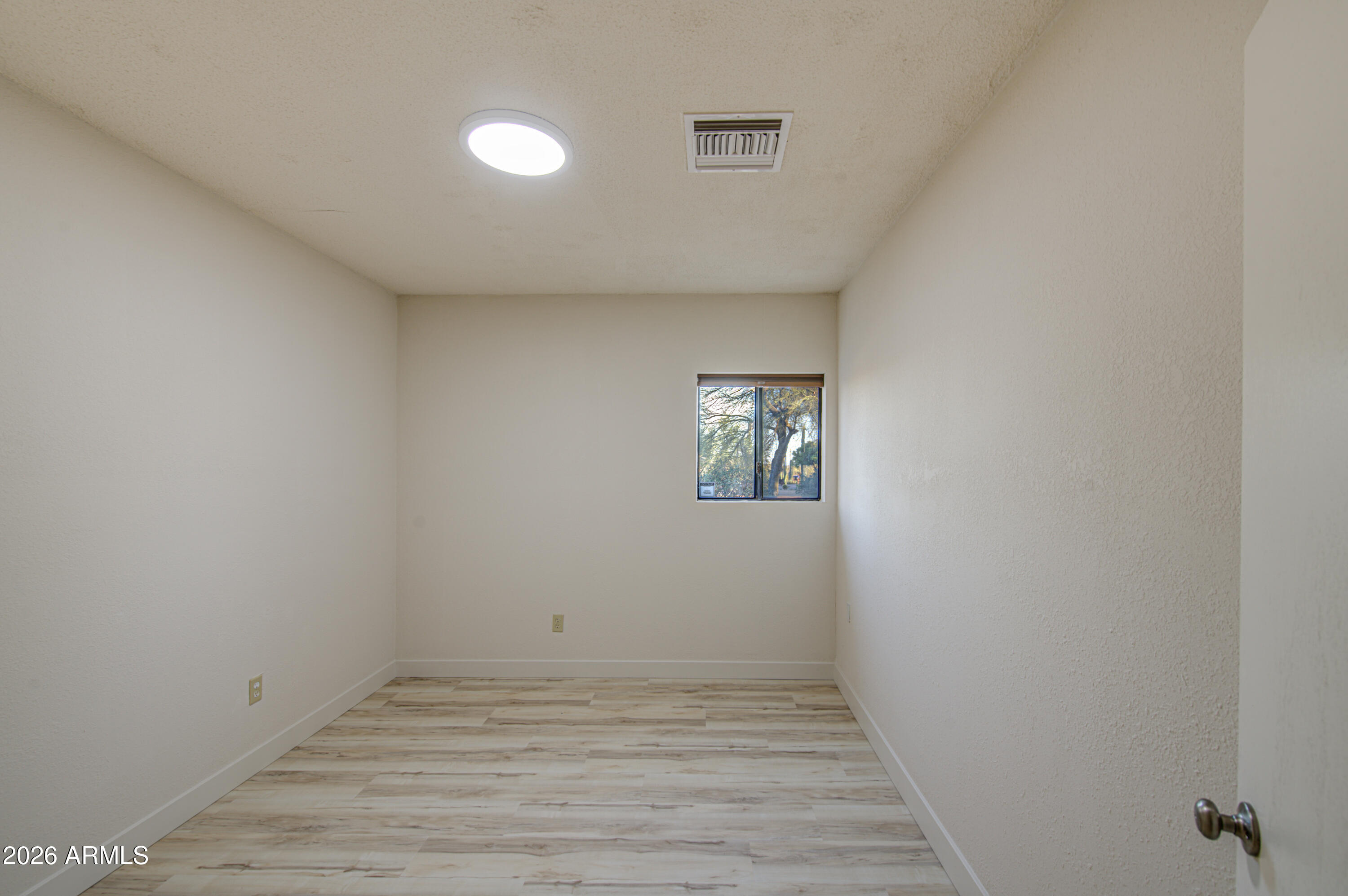 1350 North Boyd Road Apache Junction, AZ 85119 - Photo 24 of 31 a view of an empty room and wooden floor