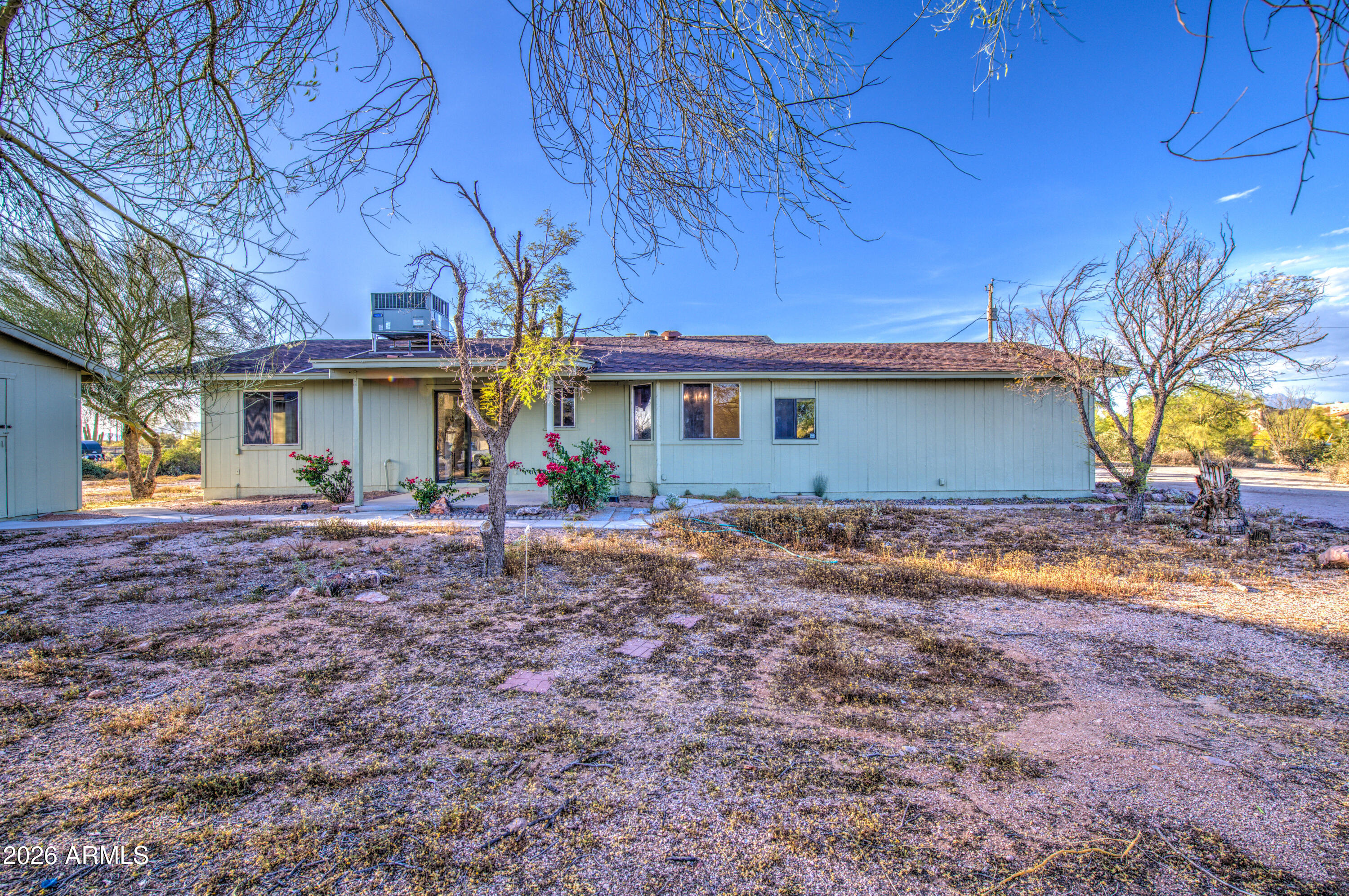 1350 North Boyd Road Apache Junction, AZ 85119 - Photo 29 of 31 a view of a house with backyard and sitting area