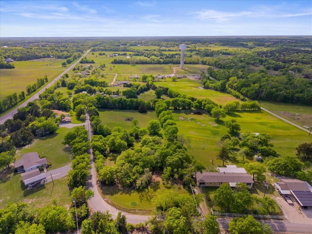 145 Wild Road Van Alstyne, TX 75495 - Photo 5 of 5 an aerial view of residential houses with outdoor space and lake view