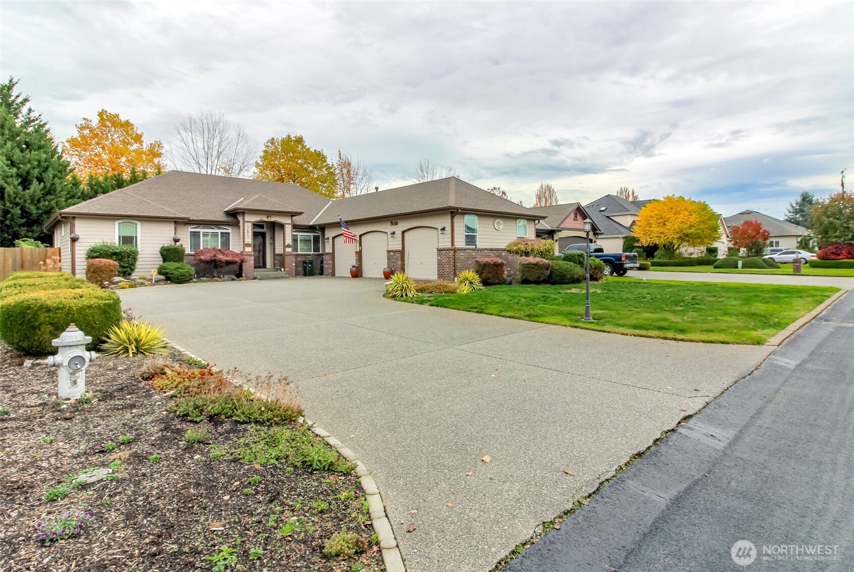 15405 148th Ave Court East Orting, WA 98360 - Photo 1 of 39 a view of a white house with a big yard and potted plants