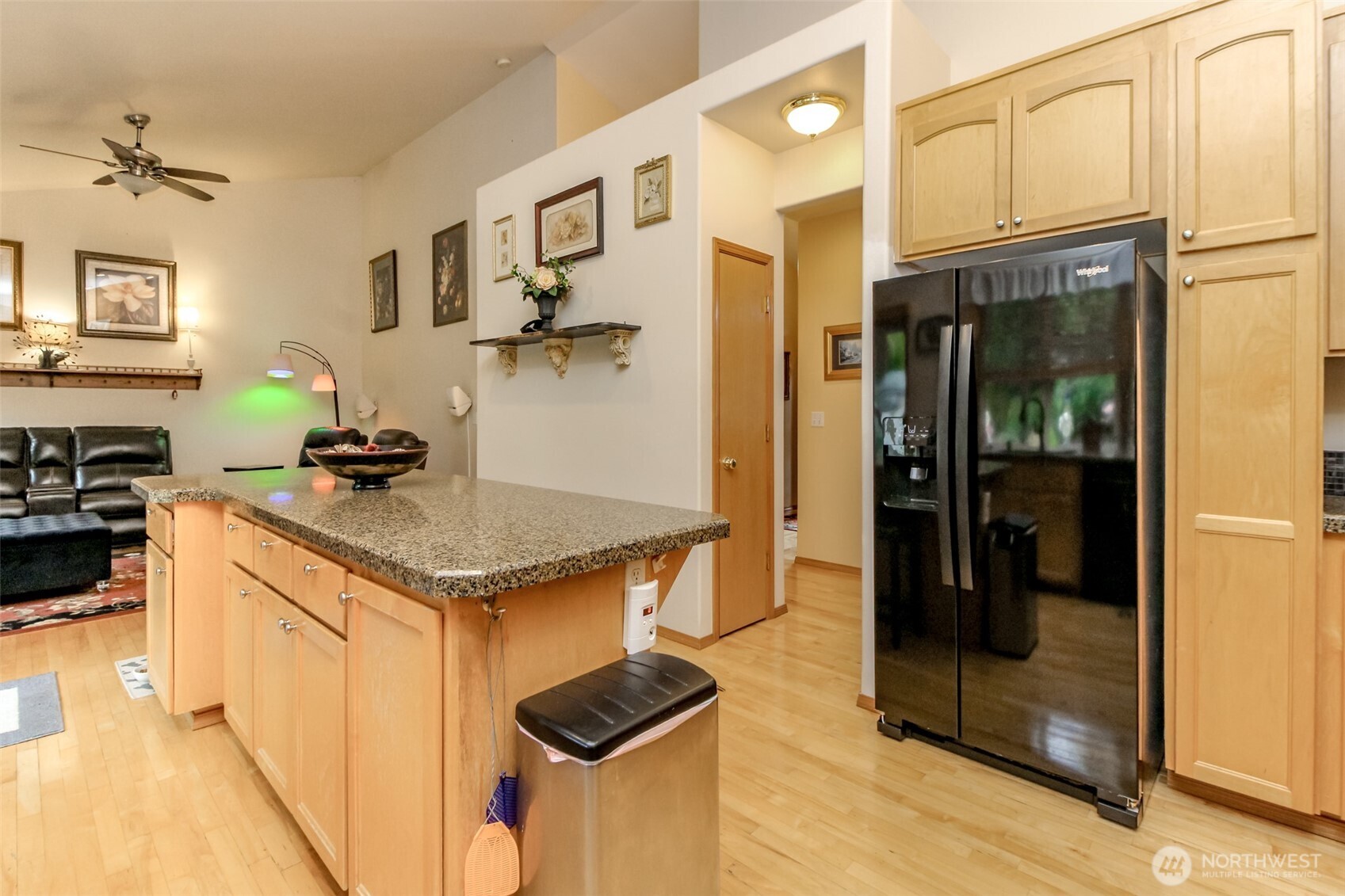 15405 148th Ave Court East Orting, WA 98360 - Photo 11 of 39 a kitchen with stainless steel appliances granite countertop a sink and a refrigerator