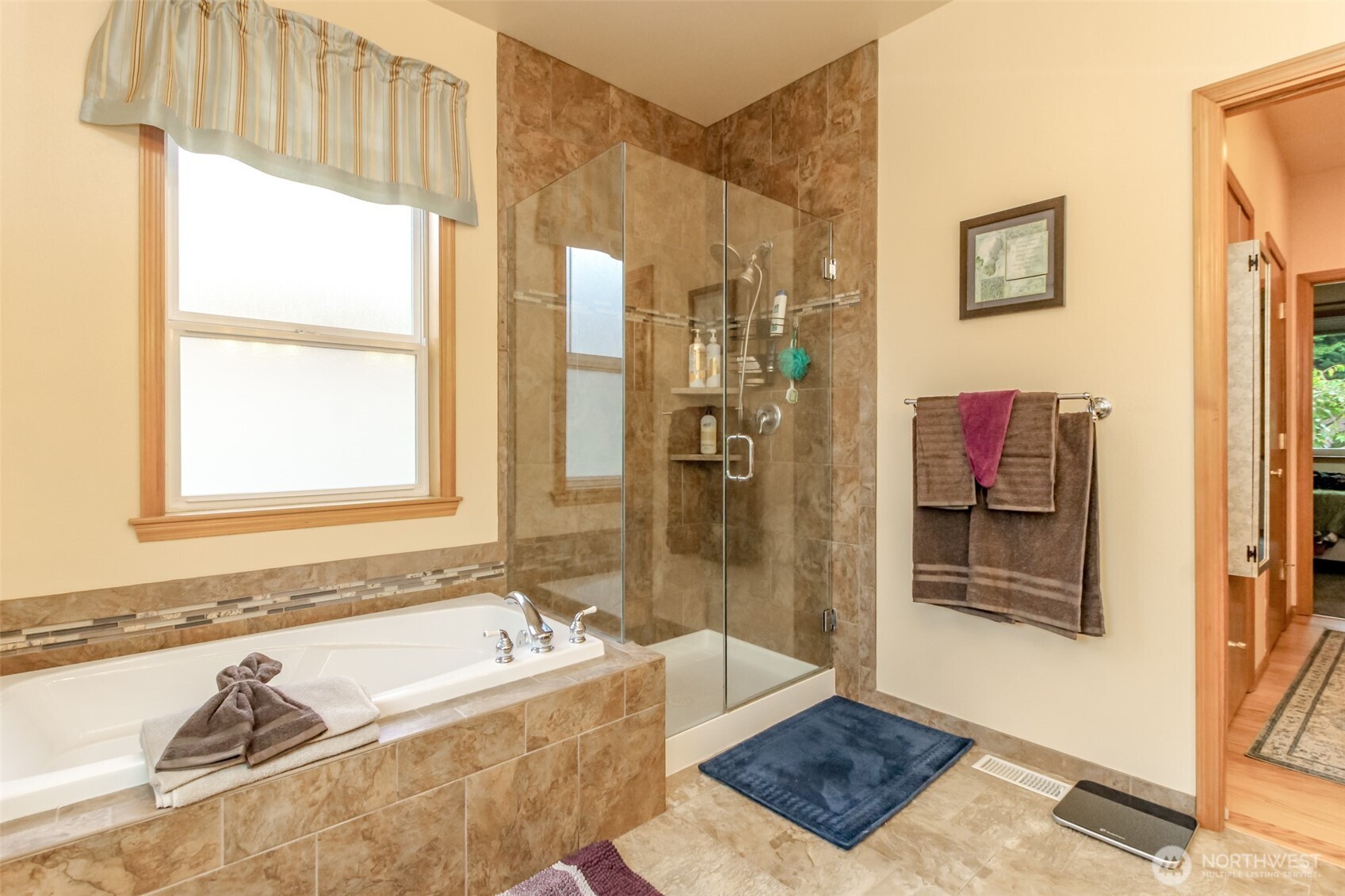 15405 148th Ave Court East Orting, WA 98360 - Photo 17 of 39 a bathroom with a tub and shower