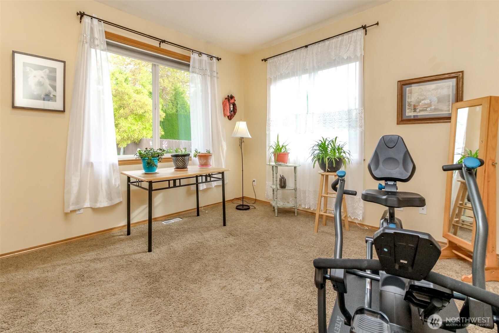 15405 148th Ave Court East Orting, WA 98360 - Photo 24 of 39 a living room with furniture and a window