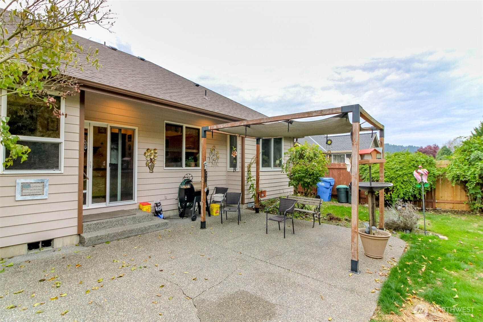 15405 148th Ave Court East Orting, WA 98360 - Photo 26 of 39 a view of a house with backyard sitting area and garden