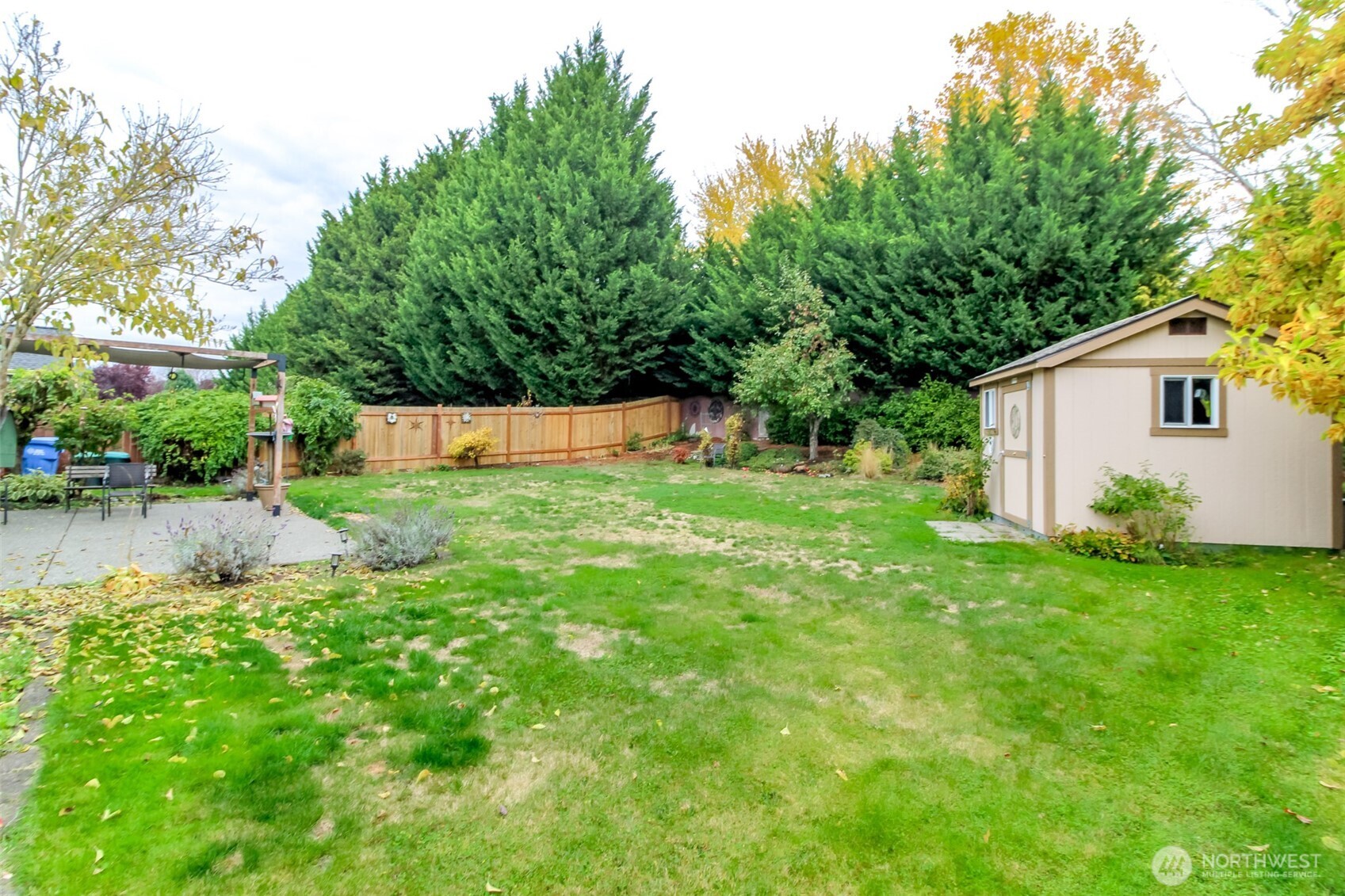 15405 148th Ave Court East Orting, WA 98360 - Photo 28 of 39 a backyard of a house with plants and large tree