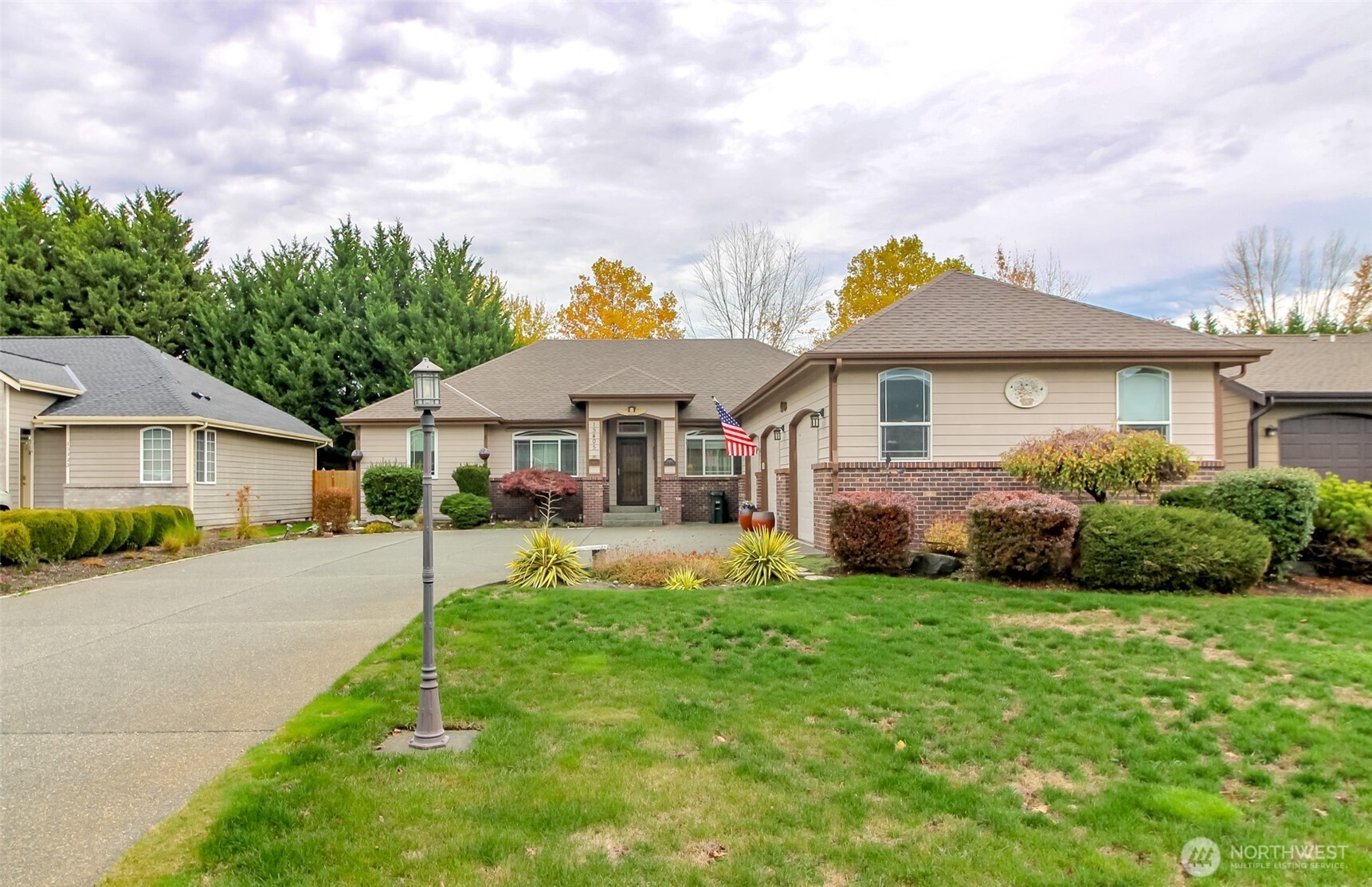 15405 148th Ave Court East Orting, WA 98360 - Photo 35 of 39 a front view of a house with a yard and garage