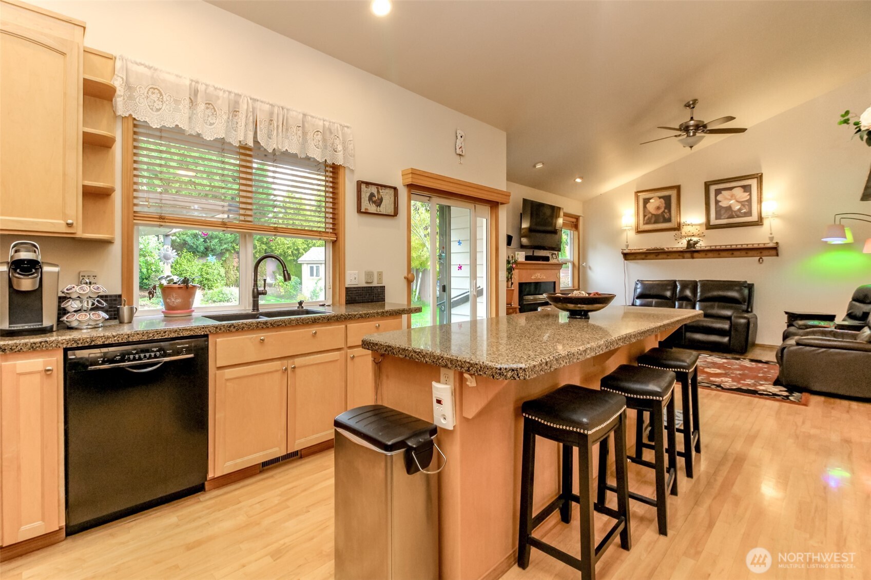 15405 148th Ave Court East Orting, WA 98360 - Photo 5 of 39 a kitchen with a table chairs sink and cabinets