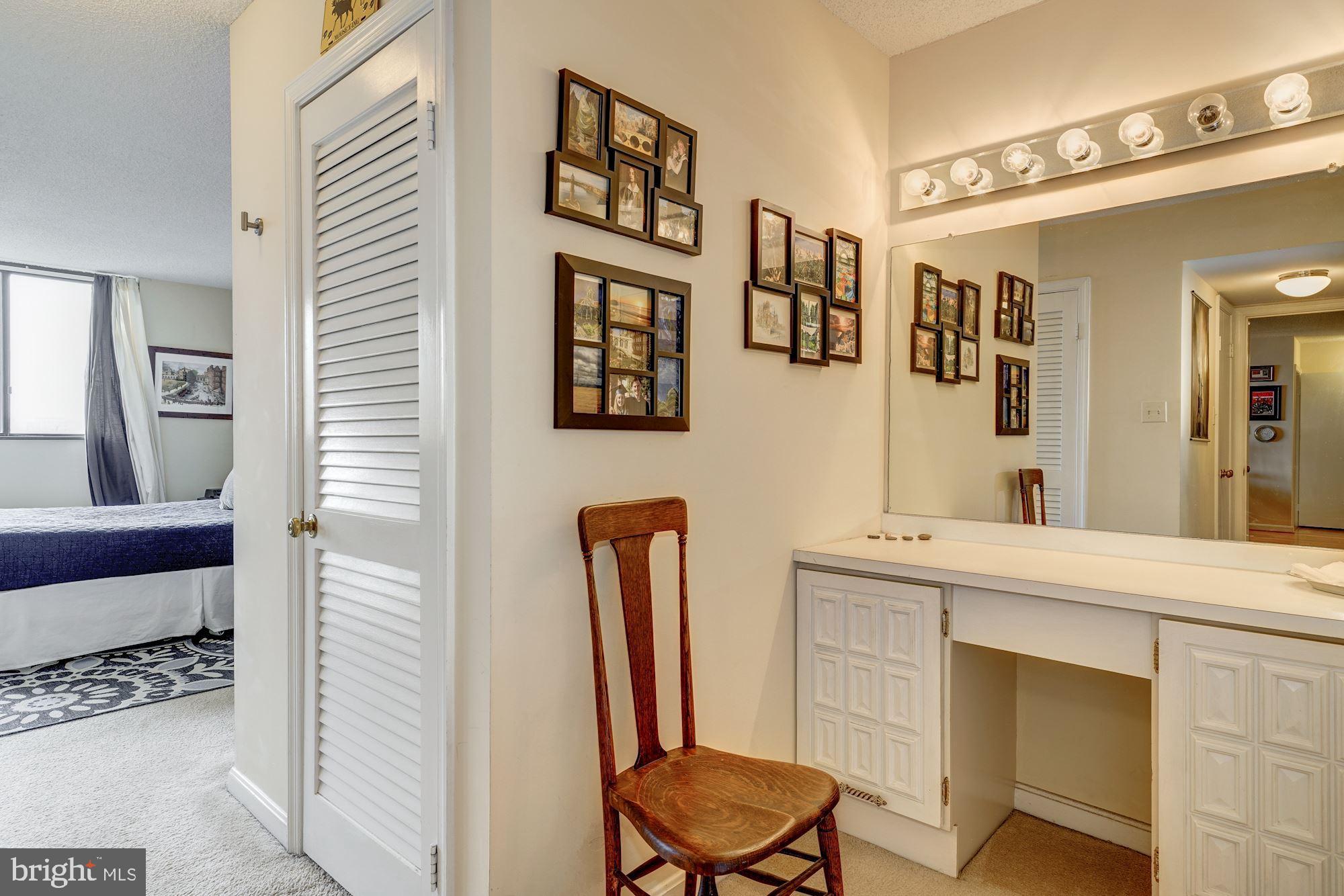 1101 South Arlington Ridge Road, Unit 704 Arlington, VA 22202 - Photo 19 of 37 a bathroom with a sink a mirror and a toilet
