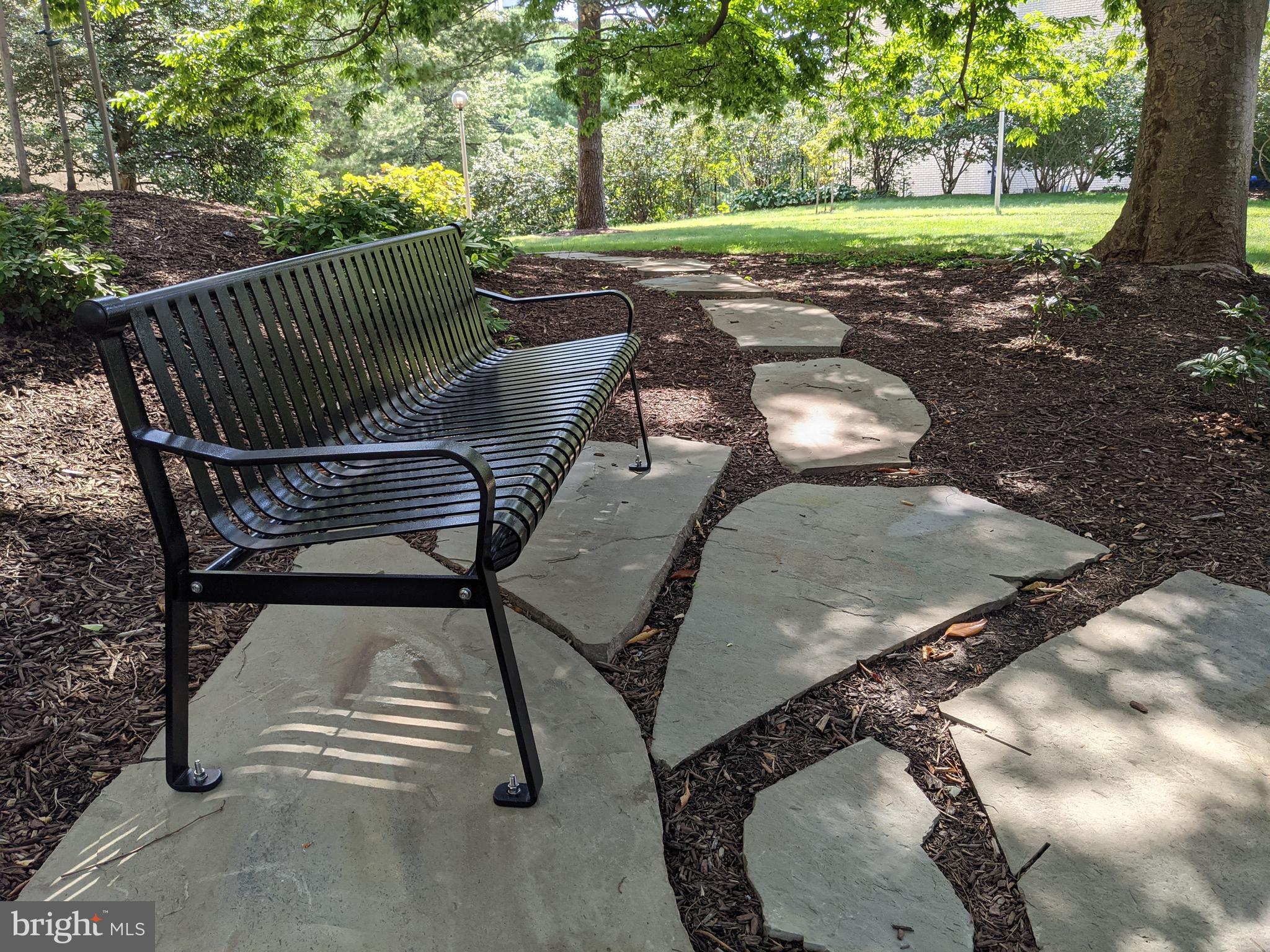 1101 South Arlington Ridge Road, Unit 704 Arlington, VA 22202 - Photo 34 of 41 a view of a patio with a table chairs and a backyard