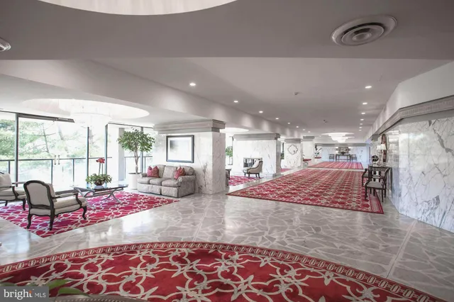 a room with lots of windows and couch