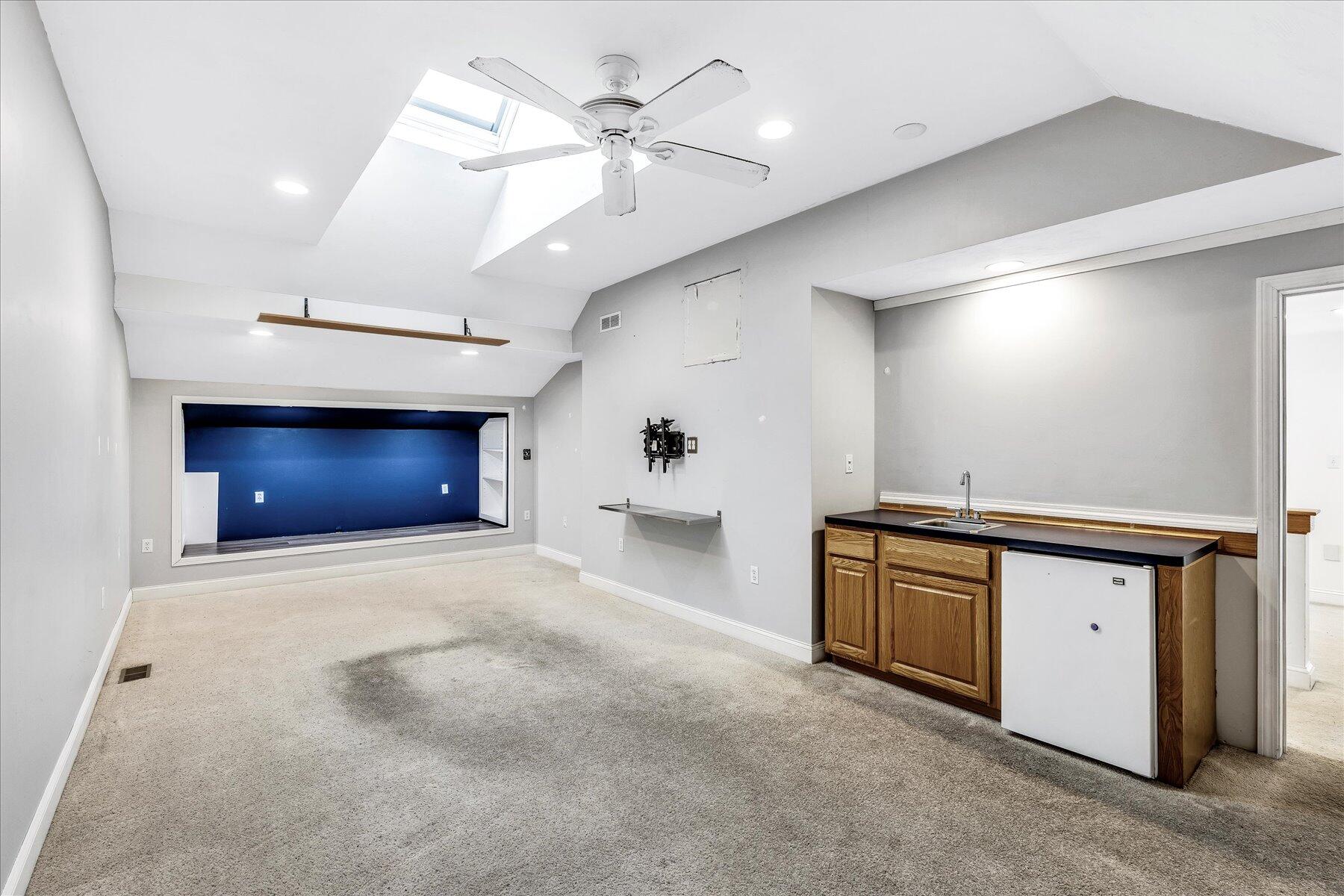 14 Bishops Park Mashpee, MA 02649 - Photo 28 of 42 a view of an empty room and kitchen view