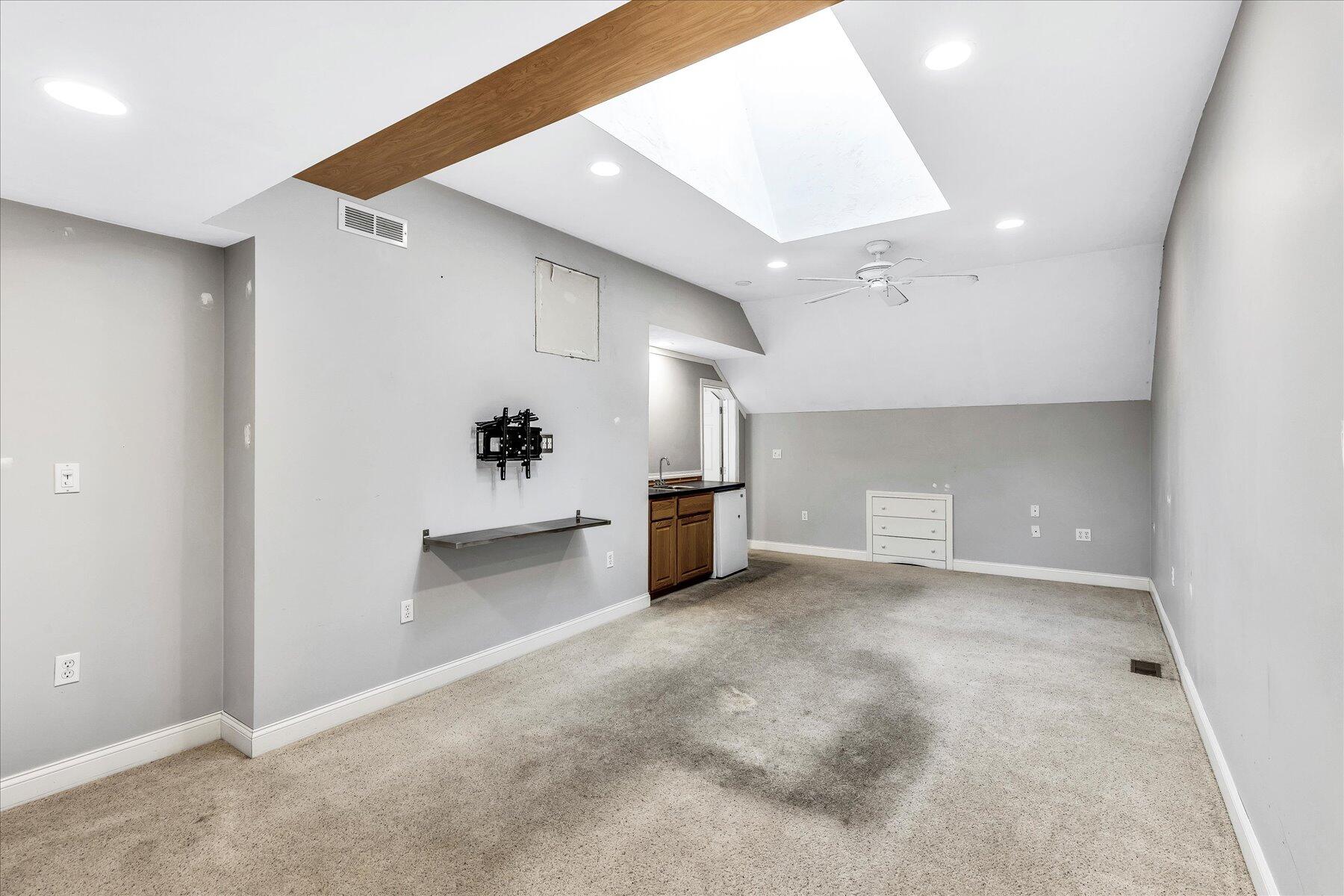 14 Bishops Park Mashpee, MA 02649 - Photo 29 of 42 a view of a livingroom with a kitchen