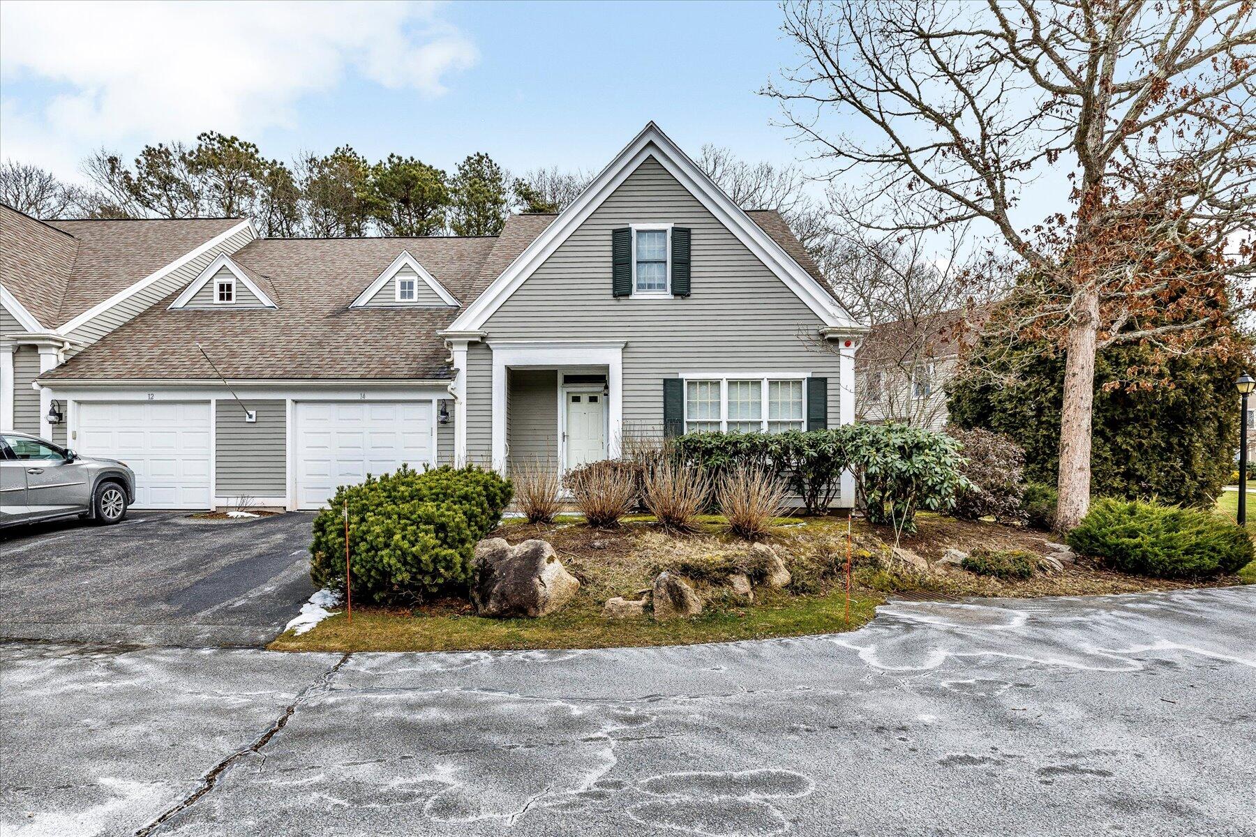 14 Bishops Park Mashpee, MA 02649 - Photo 39 of 42 a view of a house with backyard and trees in the background