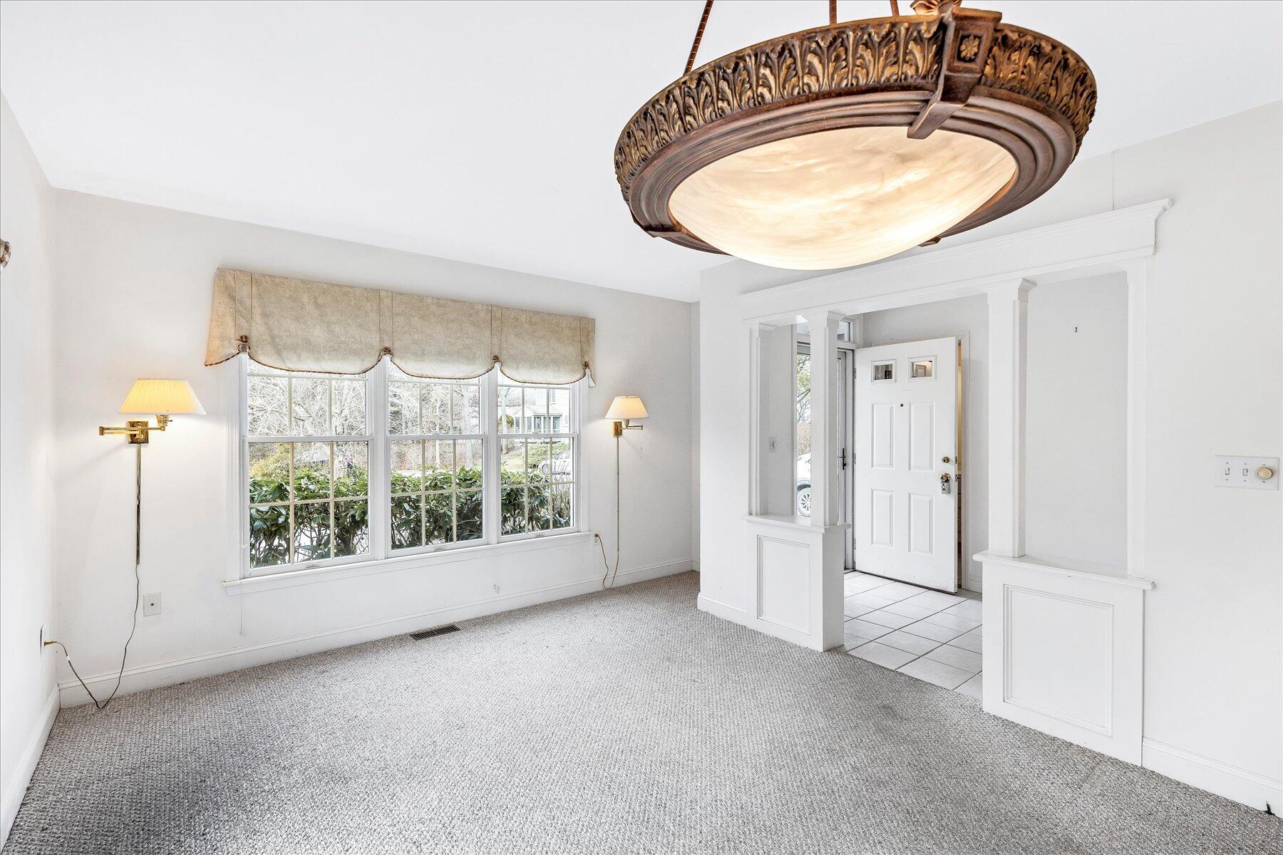 14 Bishops Park Mashpee, MA 02649 - Photo 5 of 42 a view of a livingroom with furniture and a window
