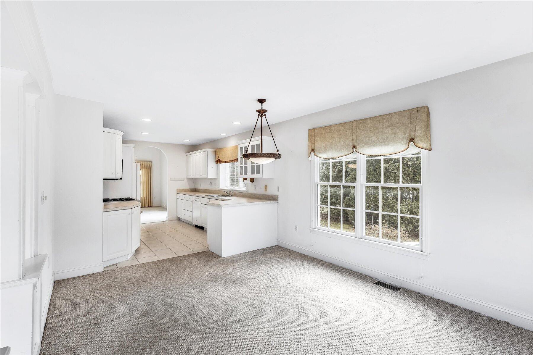 14 Bishops Park Mashpee, MA 02649 - Photo 7 of 42 a view of kitchen with windows and cabinet