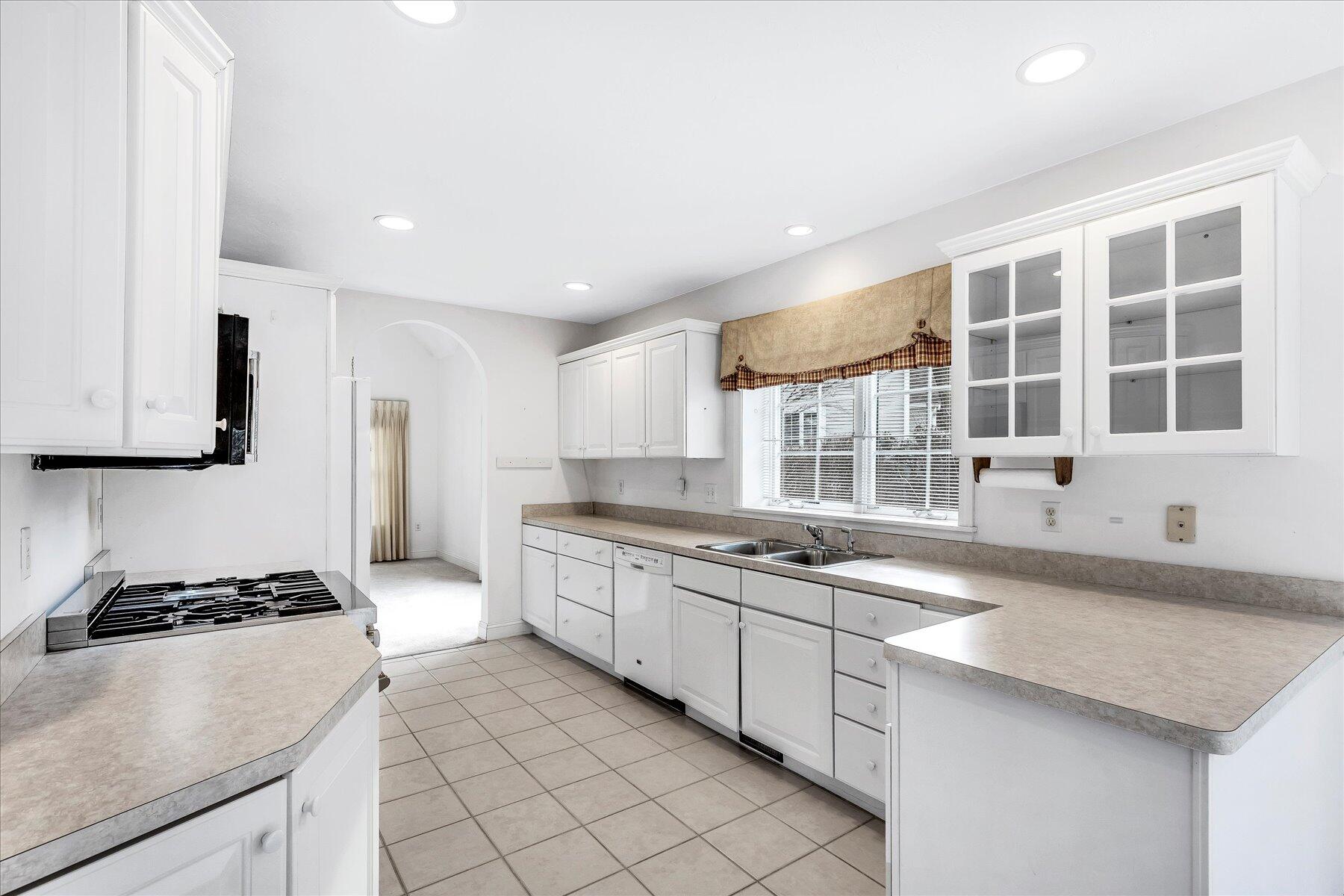 14 Bishops Park Mashpee, MA 02649 - Photo 8 of 42 a kitchen with granite countertop a sink and a stove