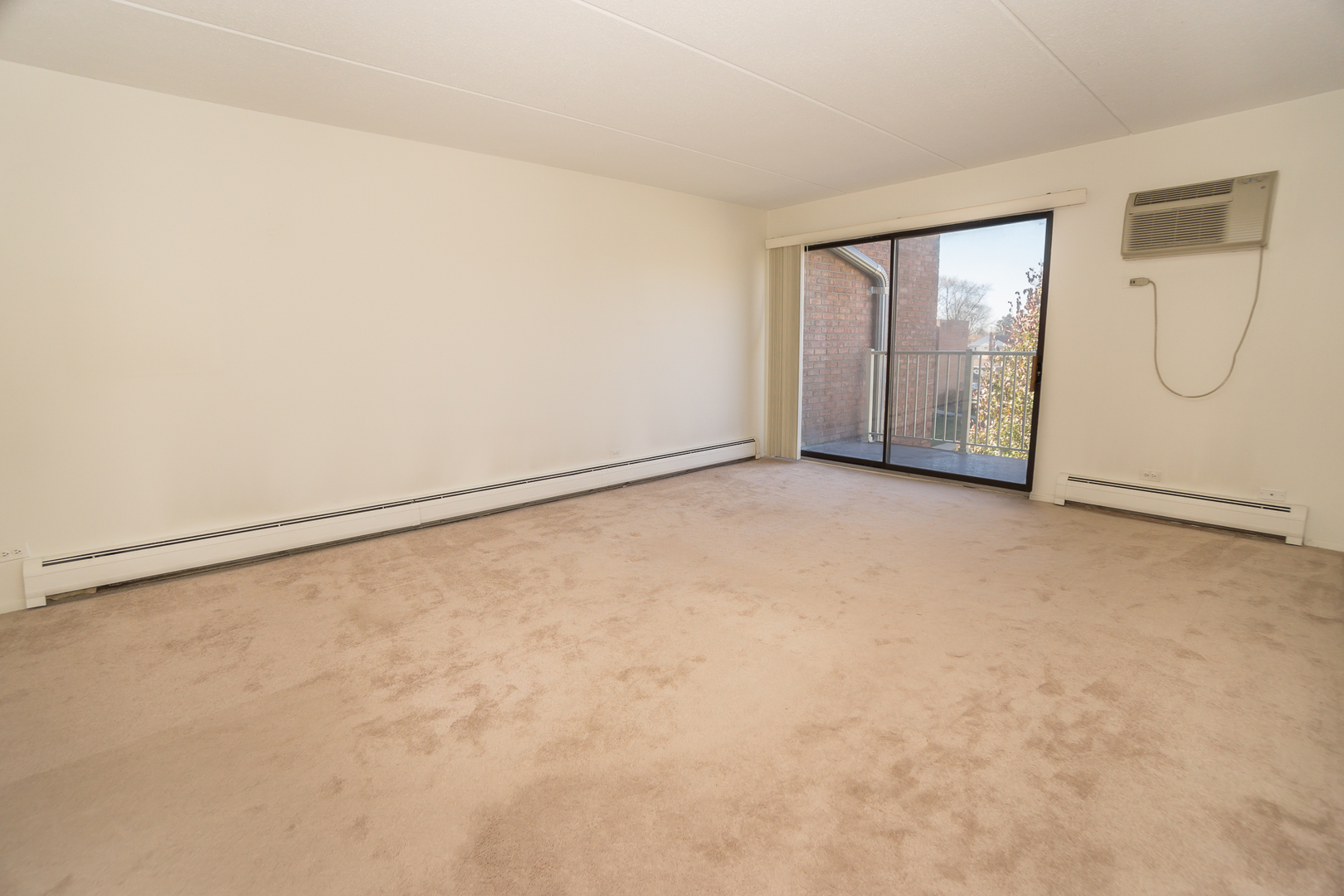 300 West Fullerton Avenue, Unit 305 Addison, IL 60101 - Photo 4 of 18 an empty room with windows